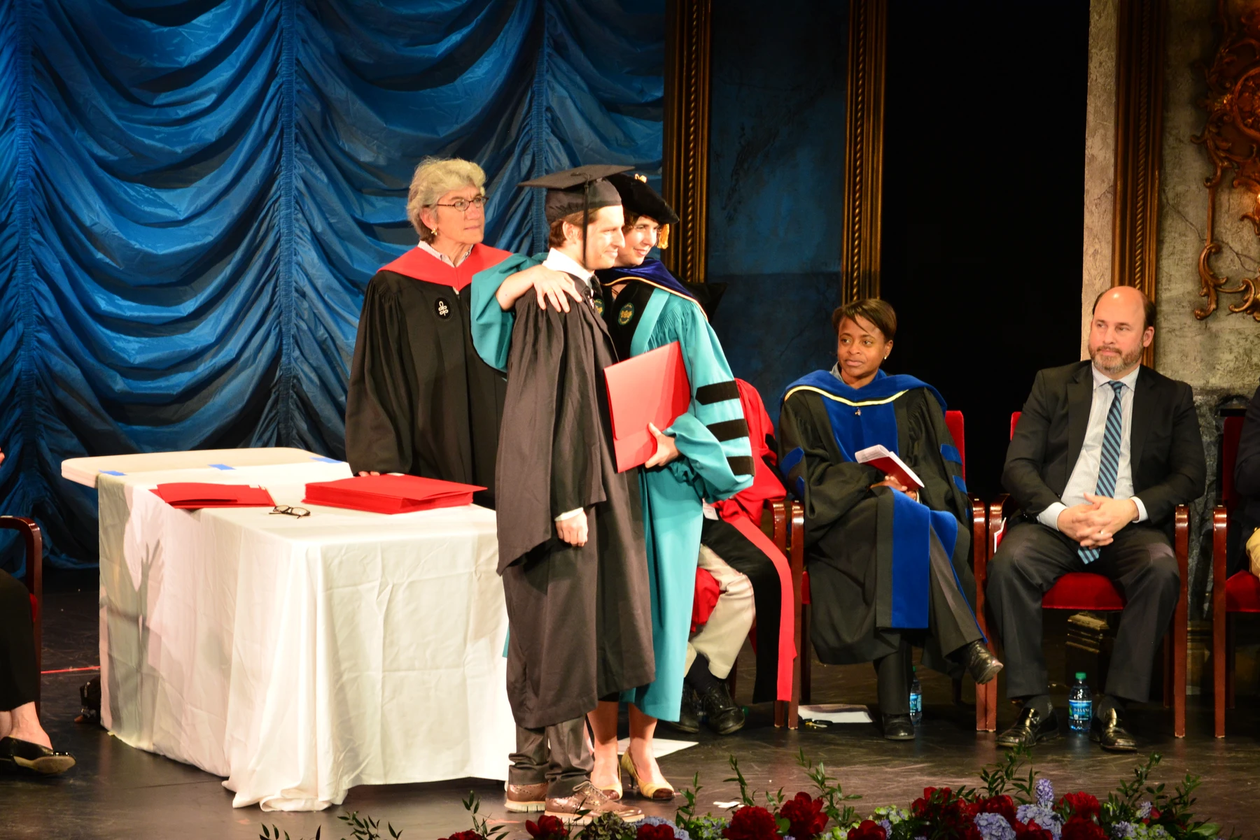 Receiving my degree on stage at commencement