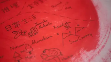A close view of the hand-lettered authors and story illustrations