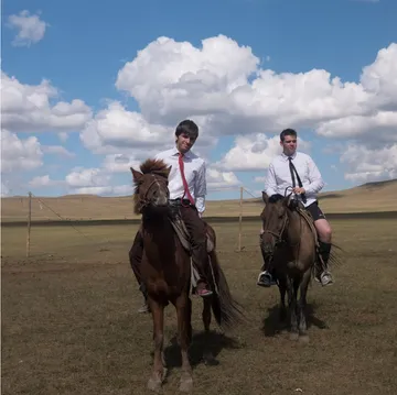 The campaign’s team photograph on horseback